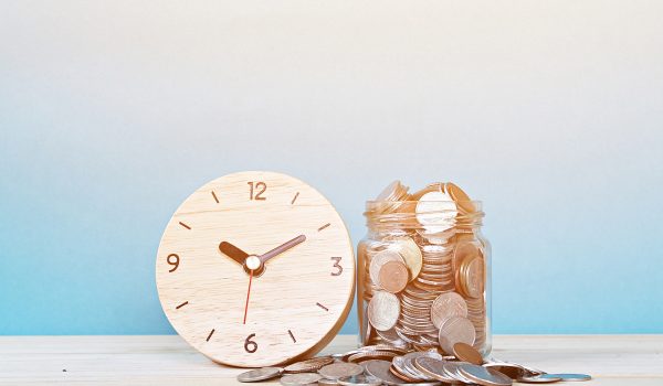 Wooden Alarm Clock And Coins On White Background