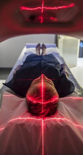 Patient Lying Inside A Medical Scanner In Hospital