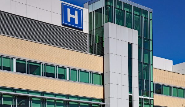 Building With Large H Sign For Hospital