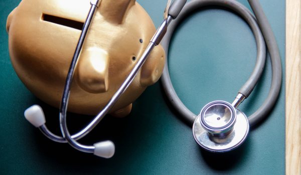 Piggy bank with Doctor’s stethoscope
