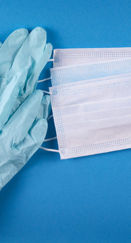 Medical Bandages And Gloves On A Blue Background.