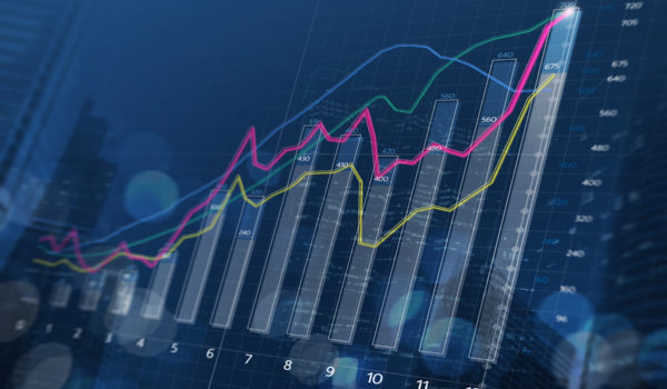 Business Growth, Progress Or Success Concept. Financial Bar Chart And Growing Graphs With Depth Of Field On Dark Blue Background.
