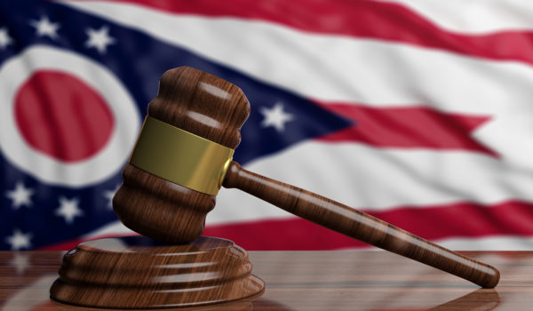 Judge Or Auction Gavel On Ohio US America Flag Background. 3d Illustration